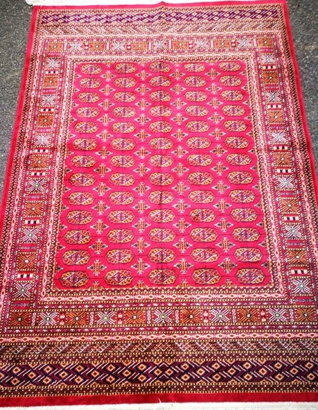 A Bokhara red ground rug 190 x 132cm